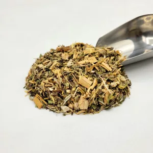 Mélange de tisane bio Choléquilibre du Docteur Sammut avec plantes médicinales et pelle à thé pour la régulation du cholestérol.