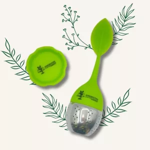 Infuseur à thé et tisane en silicone vert, design feuille, pour préparation de plantes en vrac.